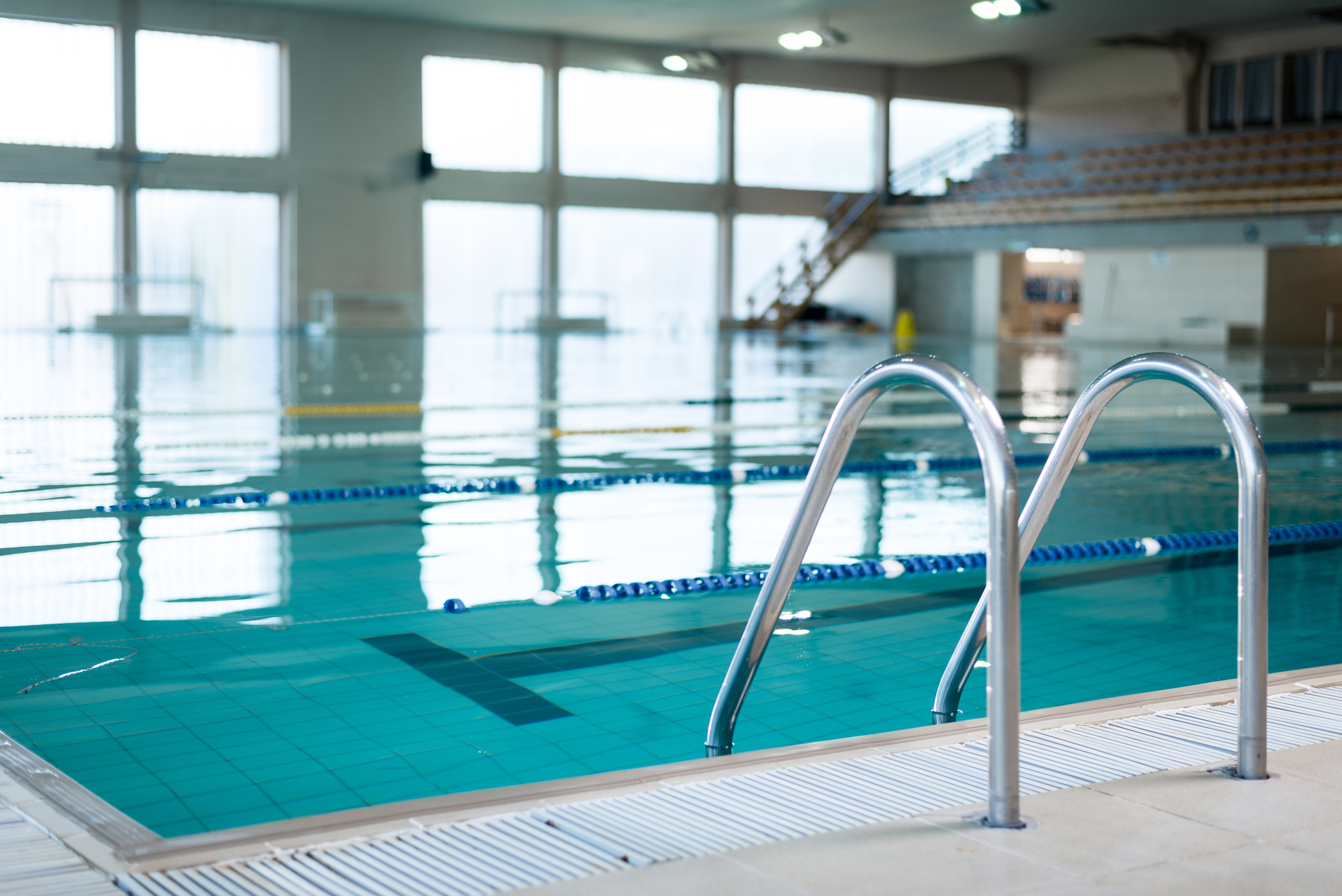 Close-up of a pool ladder of an indoor swimming pool. 